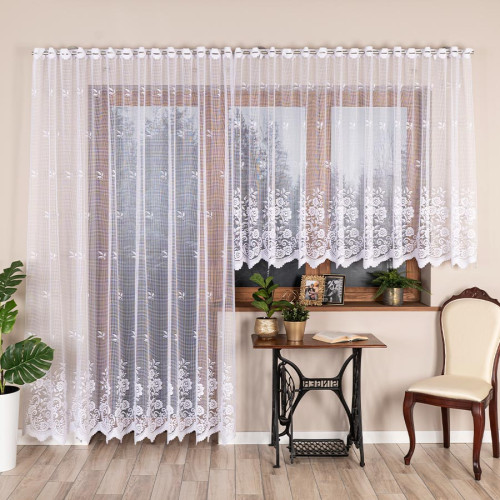 Długa gotowa, biała firanka żakardowa z fabrycznymi otworami na drążek karnisza, wykończona delikatną falą, rozmiar 300x250 cm Sara