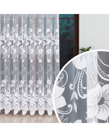 alt="Biała długa firanka żakardowa do salonu z kwiatowym wzorem w dwóch pasach."