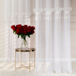 Firana do salonu na przelotkach Egret z ozdobnym pasem z frędzelkami rozmiar 140x250 cm 